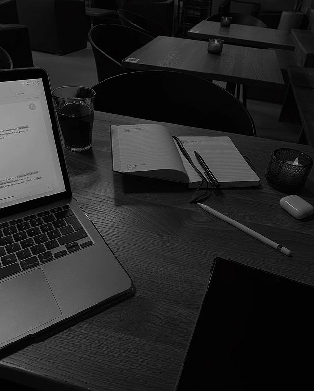 Workspace setup with laptop and notebook representing digital marketing strategy by a freelance digital marketer in Saudi Arabia.
